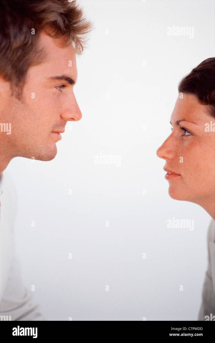 Men looking to each other profile hi-res stock photography and images ...