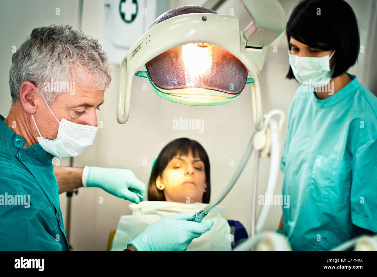 Dentist and assistant working in office Stock Photo Alamy