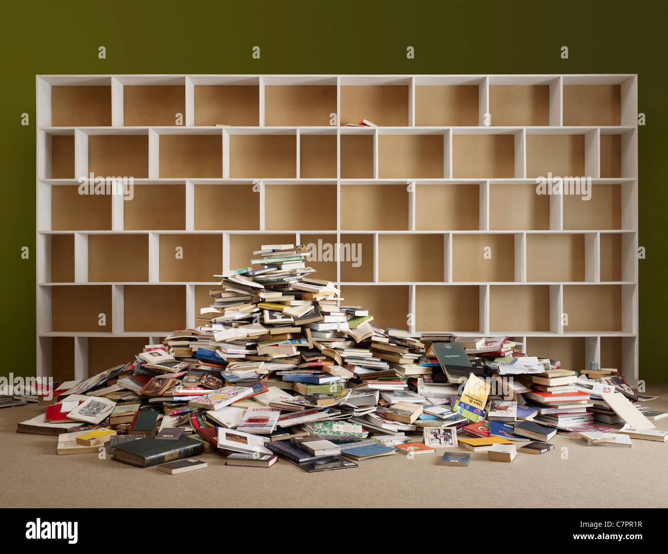 Pile of books by empty shelves hires stock photography and images Alamy