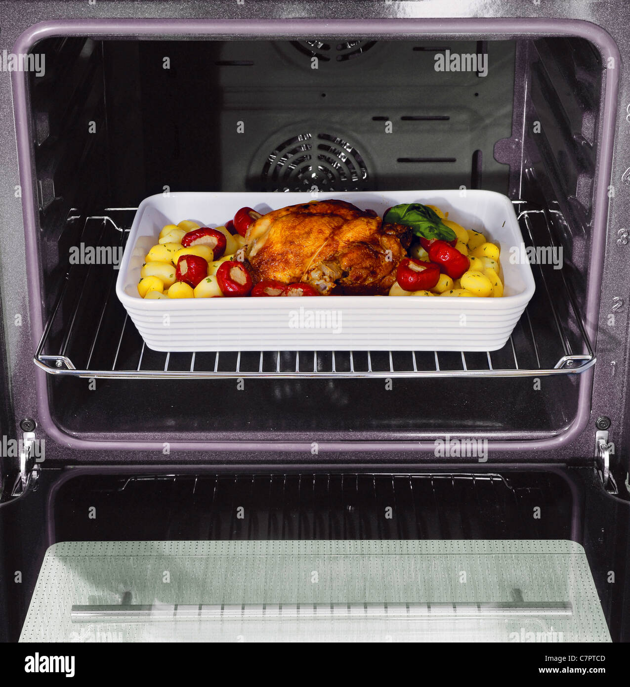 roast chicken and potatoes in the oven Stock Photo - Alamy
