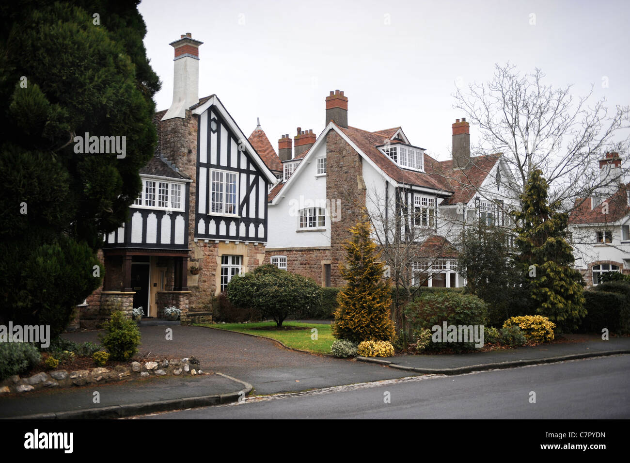 A suburban street in England UK with characteristic 'Mock Tudor' houses Stock Photo