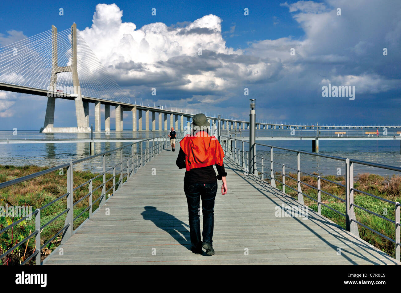 Portugal, Lisbon: Woman walking at the riverside area in the the Nation´s park Stock Photo