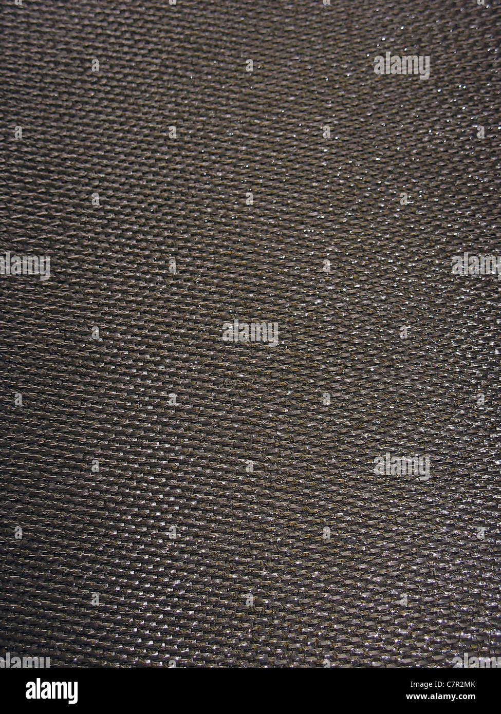 Real carbon fiber in its raw form - this is the material that is used to make durable and light weight parts. Stock Photo