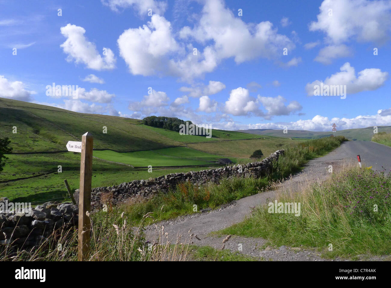 A sign in the Yokrshire Dales marking the footpath to Faw Head Stock Photo