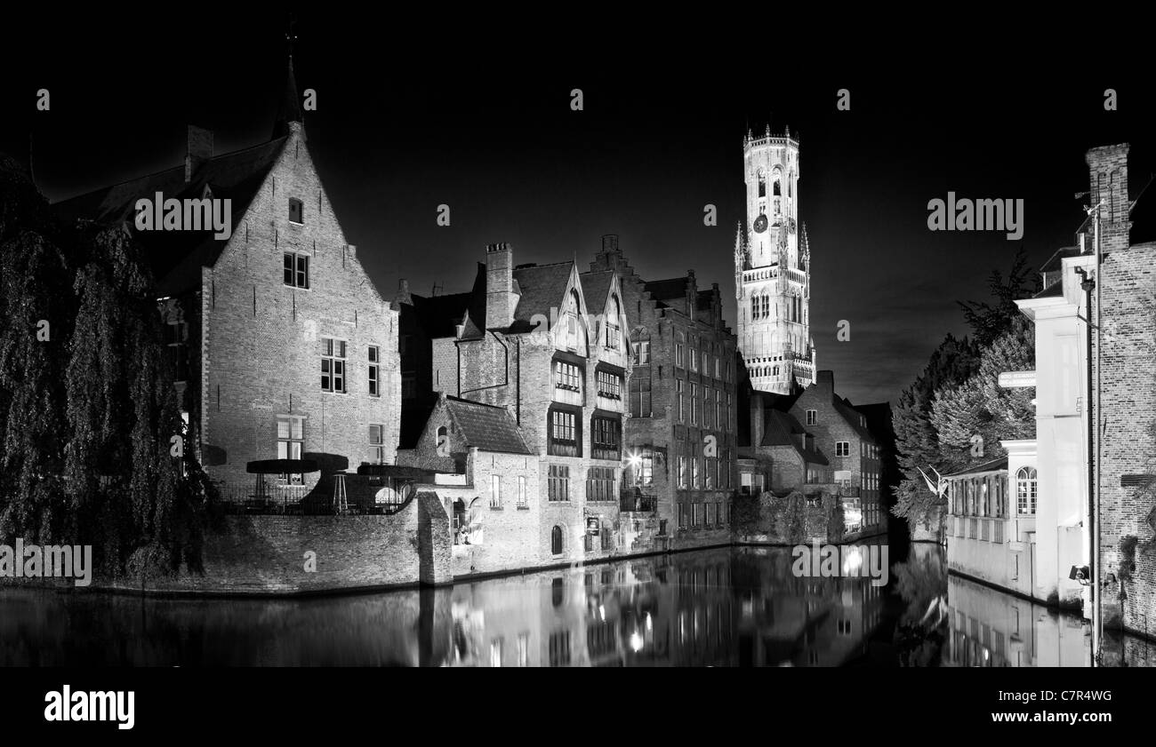 The famous view of the Belfry from the Rozenhoedkaai in Bruges, Belgium at twilight. Colour version available at C7R4TB Stock Photo