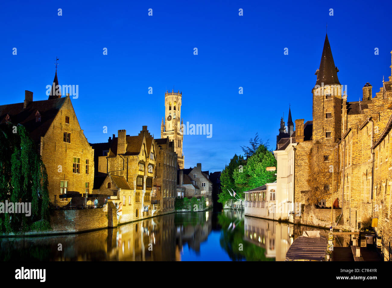 The famous view of the Belfry from the Rozenhoedkaai in Bruges, Belgium at twilight. Stock Photo