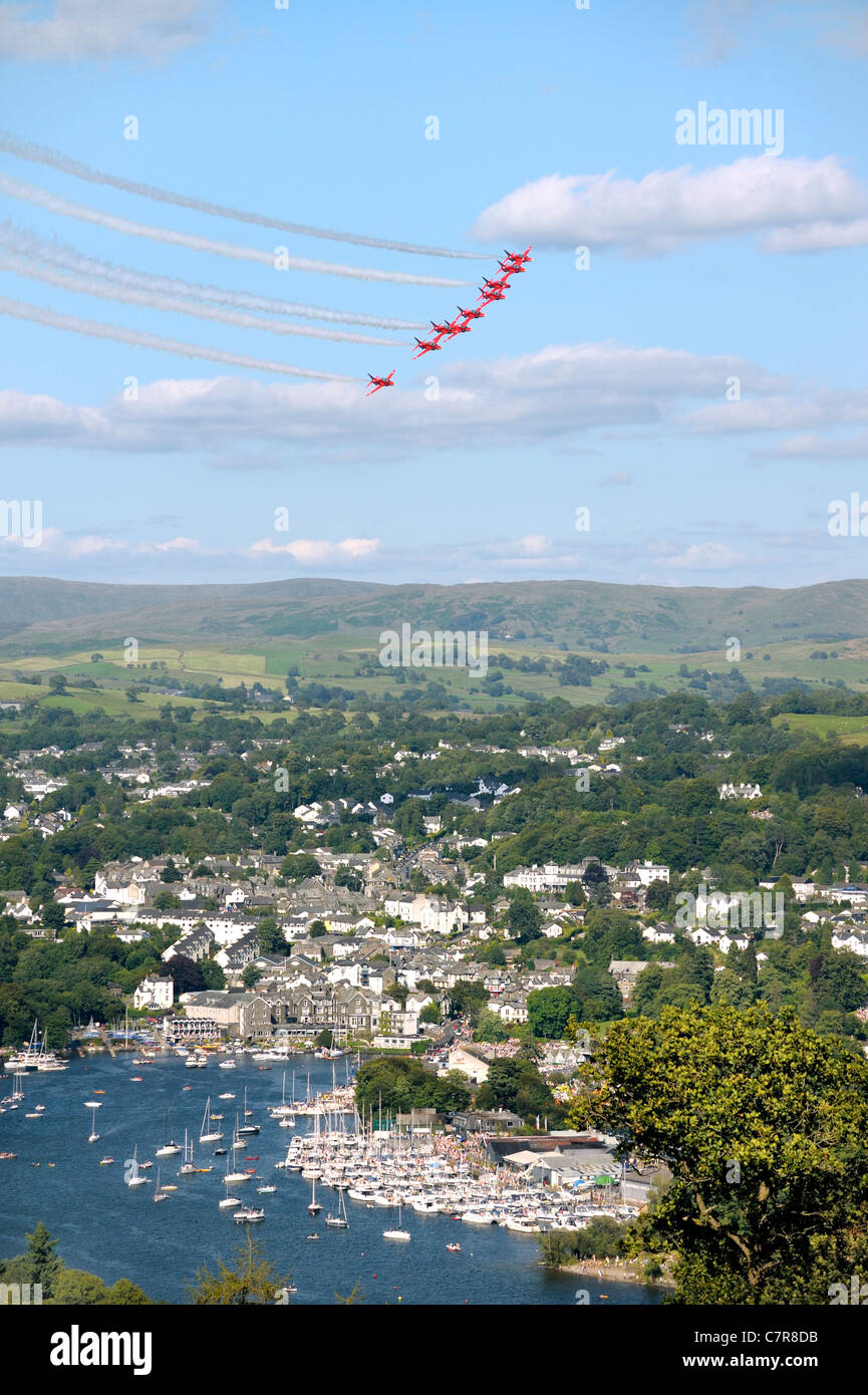 Red Arrows Royal Air Force Aerobatic Team fly in formation above Bowness during Windermere Air Festival, Cumbria, UK Stock Photo