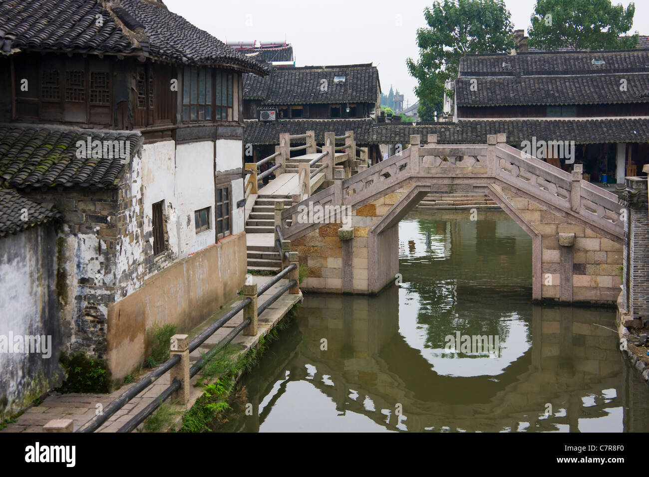 Old residence and stone bridge on the Grand Canal, Xitang, Zhejiang Province, China Stock Photo