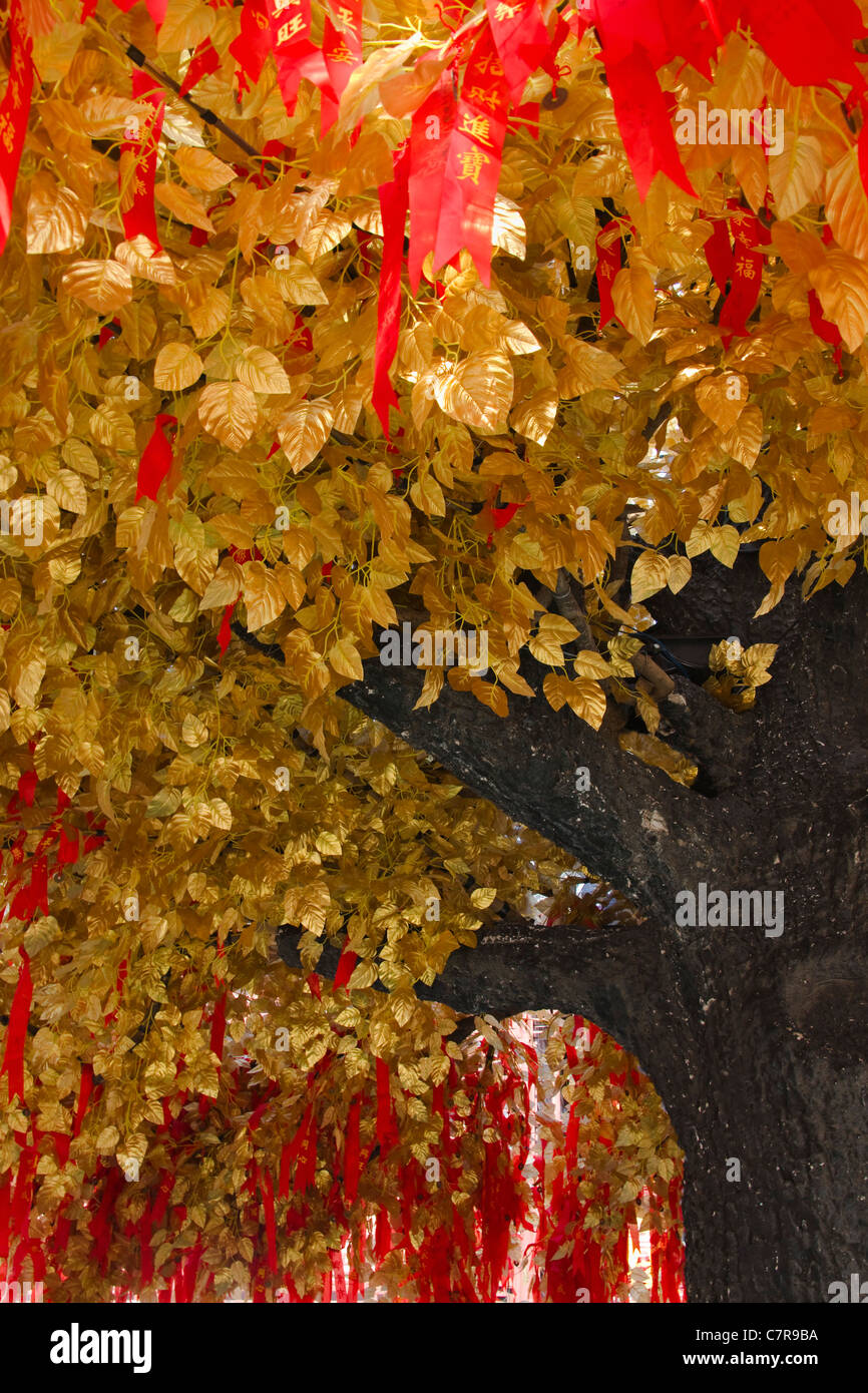 Good wish tree decorated with red ribbons and golden leaves, Nanjing, Jiangsu Province, China Stock Photo