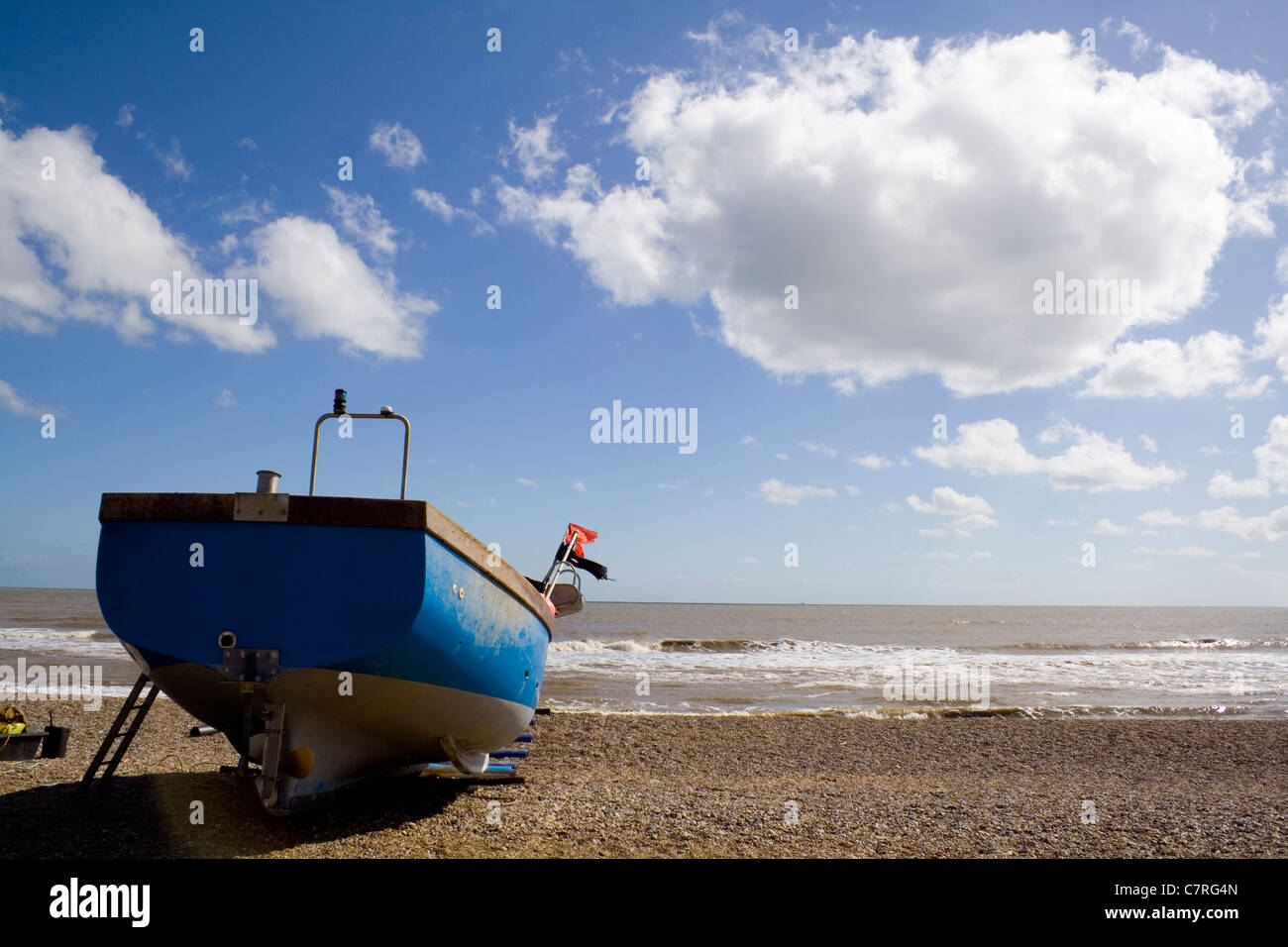 A working coastal fishing boat resting between jobs Stock Photo Alamy