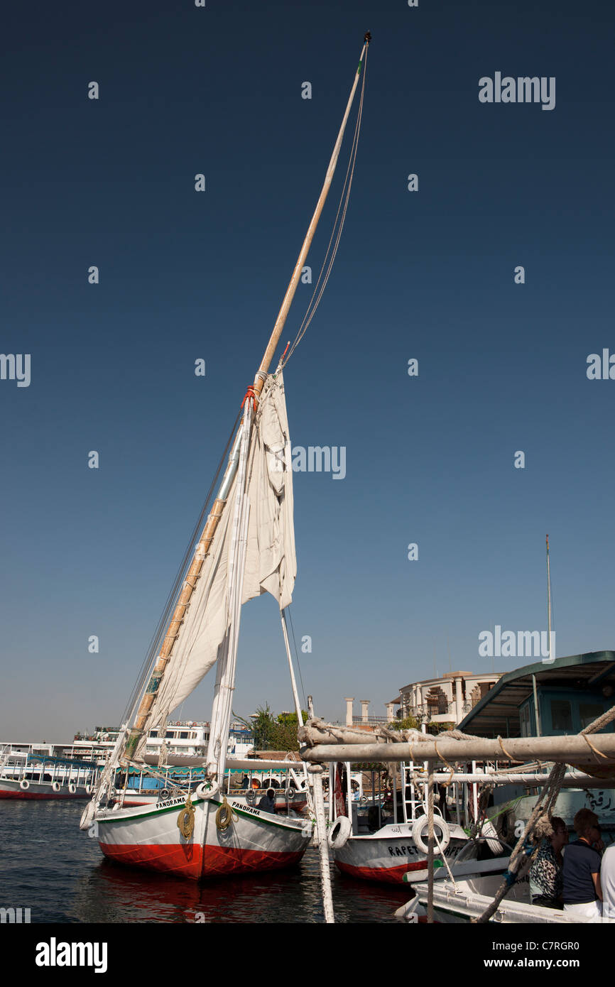 A traditional felucca alongside at Aswan, River Nile, Egypt, Africa. Stock Photo