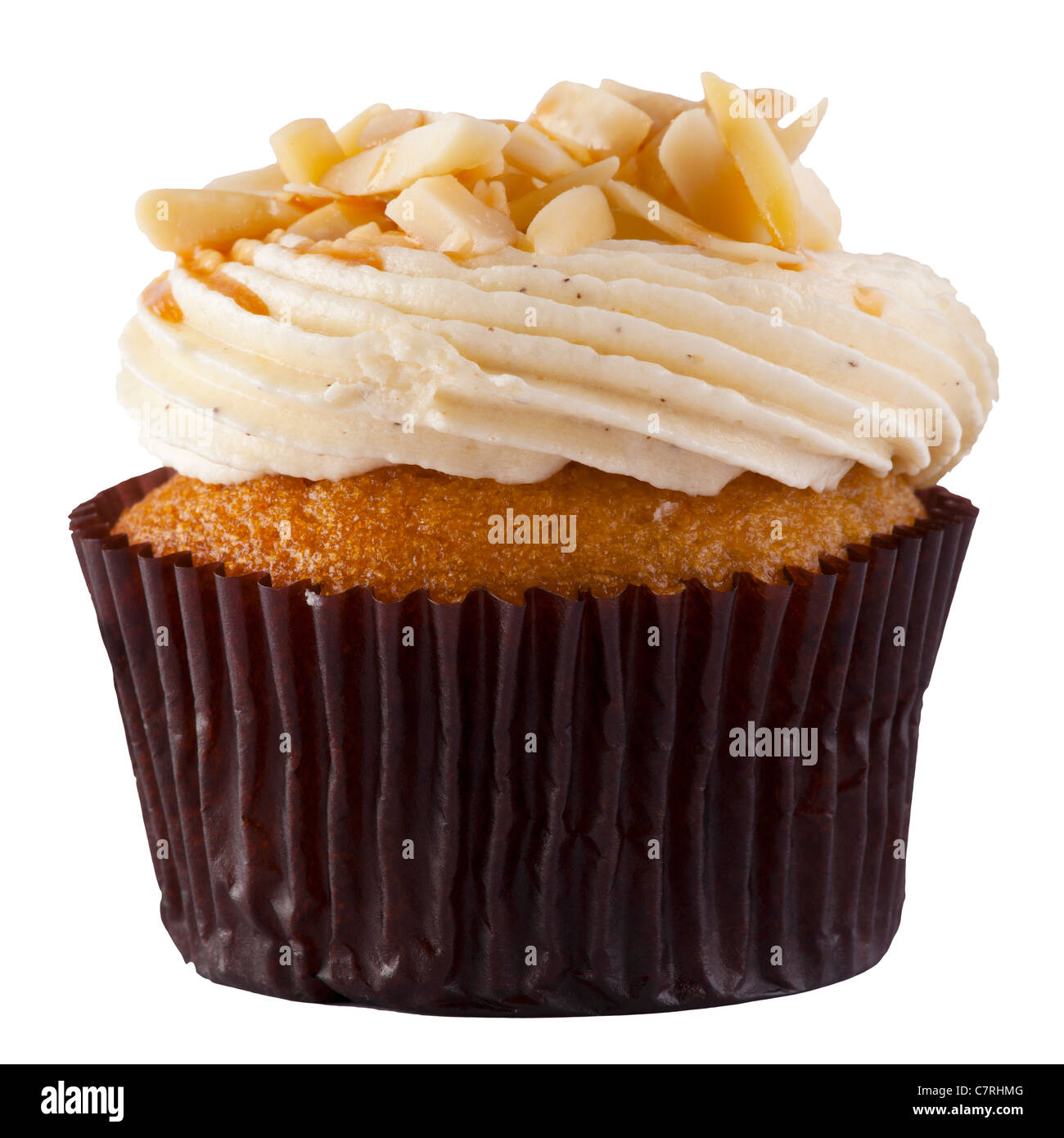 A Luxury Cup Cake with almond chip and cream topping Stock Photo
