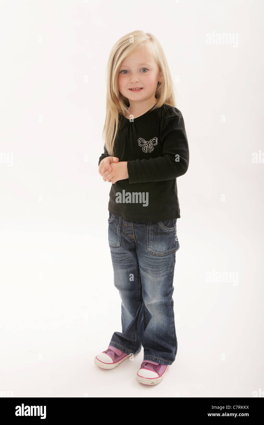 Cute five year old standing looking towards camera Stock Photo - Alamy