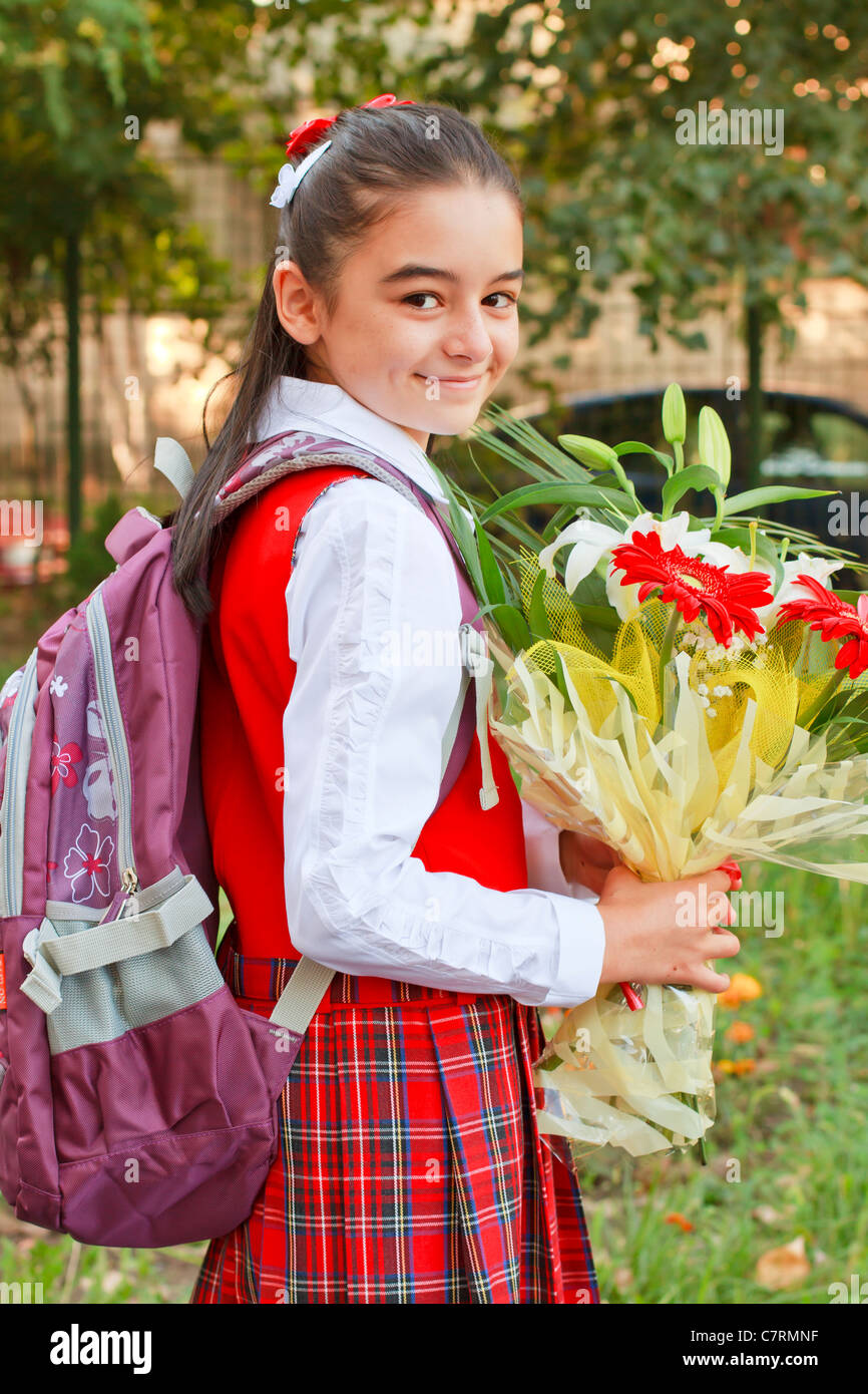 A pretty young girl on her way to school Stock Photo