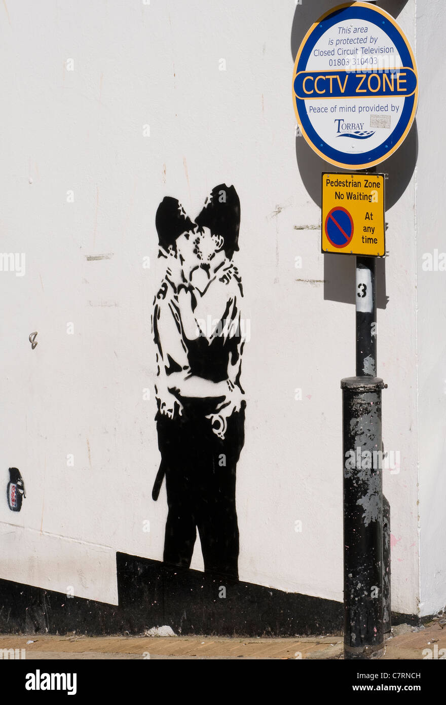 Banksy is a pseudonymous England-based graffiti artist,this image was found in Brixham,Devon and is probably a fake.CCTV sign Stock Photo