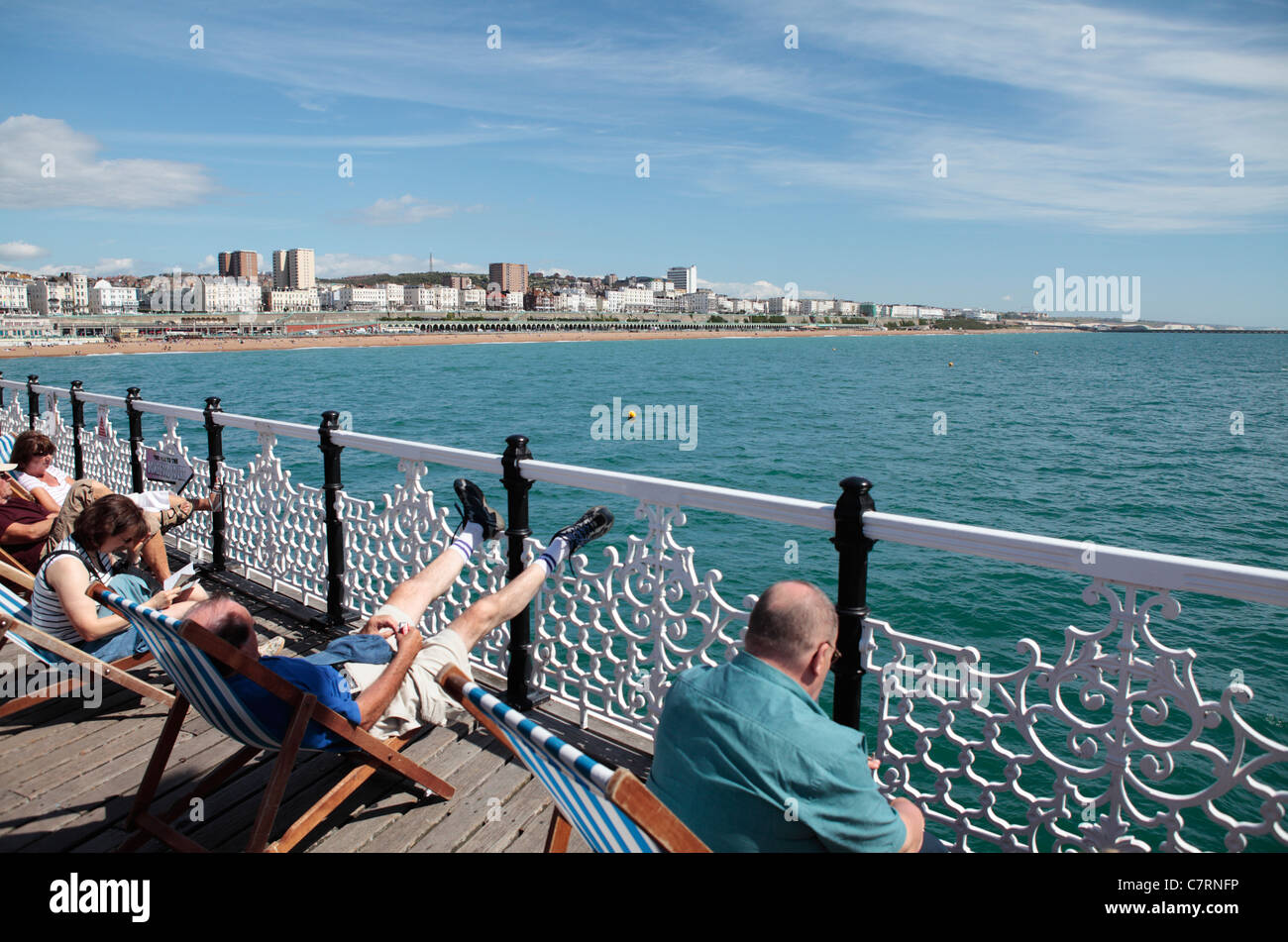 Brighton pier beach deck chairs hi-res stock photography and images - Alamy