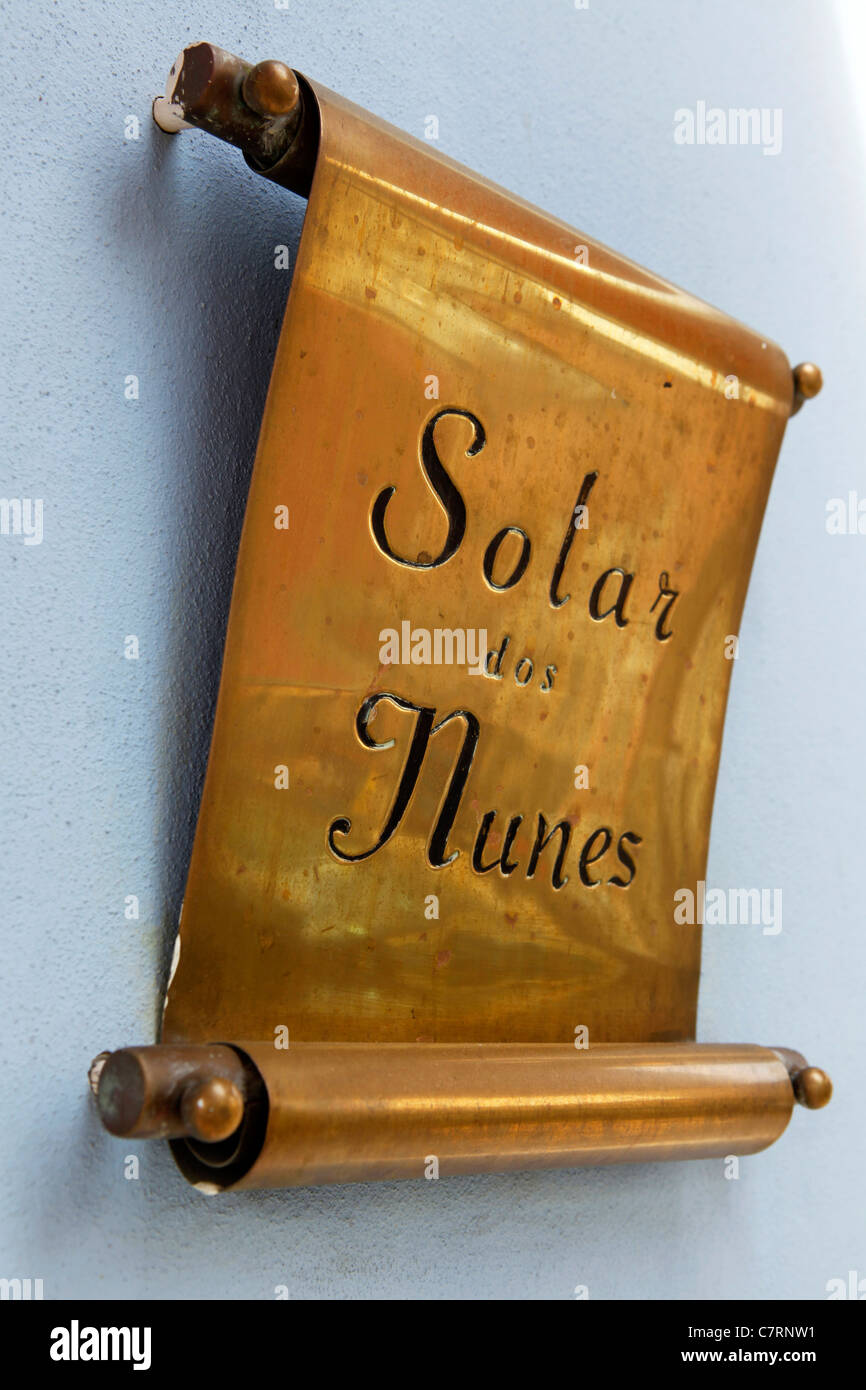 The brass nameplate of the Solar dos Nunes restaurant in Lisbon, Portugal. Stock Photo