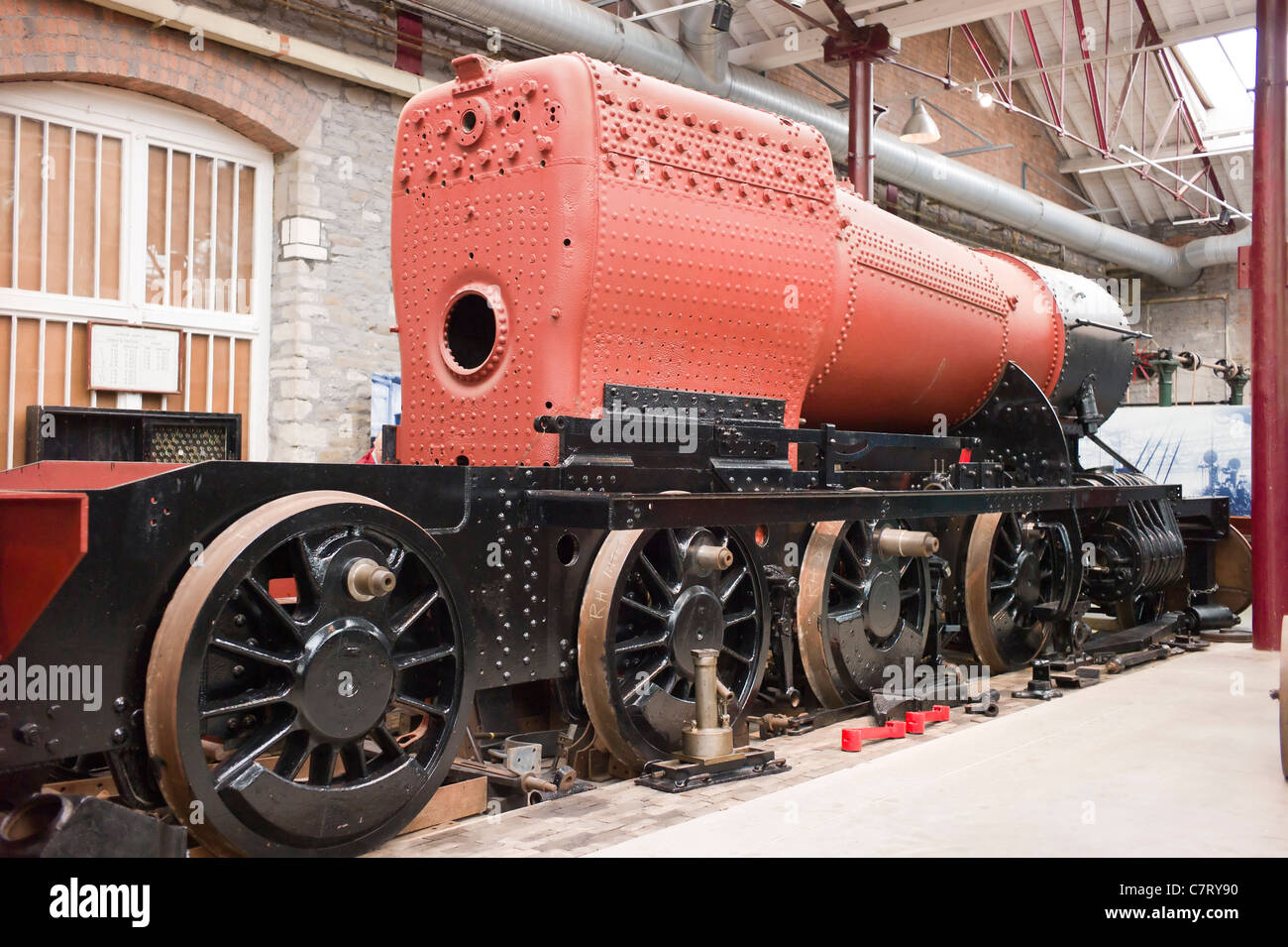 Boiler and railway engine chassis showing construction in STEAM museum in Swindon UK Stock Photo