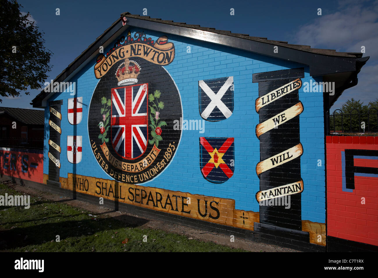 Loyalist terrorist wall mural depicting the young newton ulster defence union, newtownards road, Belfast, Northern Ireland, UK. Stock Photo