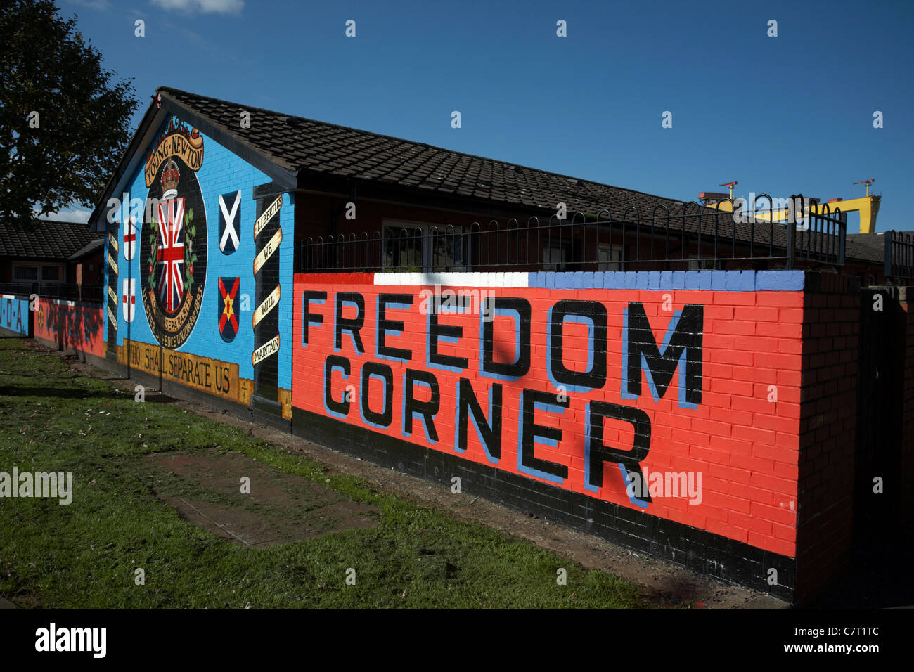 Loyalist terrorist wall mural depicting the young newton ulster defence union at the locally named 'Freedom Corner', Stock Photo