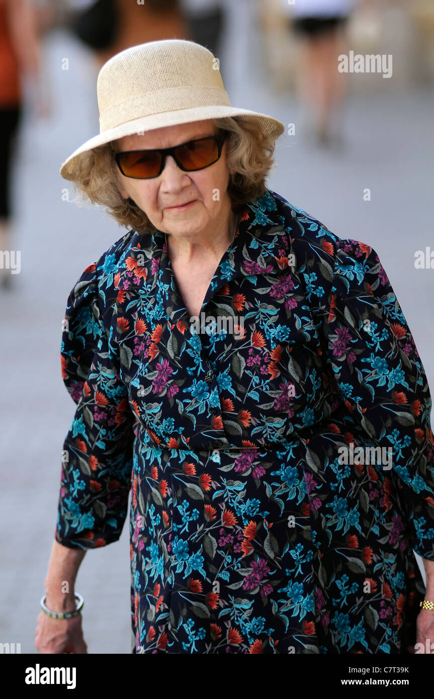 Old lady walking down the street hi-res stock photography and images ...