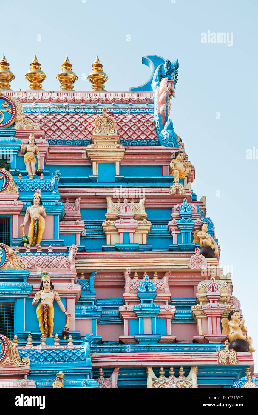 Indian gopuram temple architecture in the South Indian town of Puttaparthi showing hindu sculpture Stock Photo