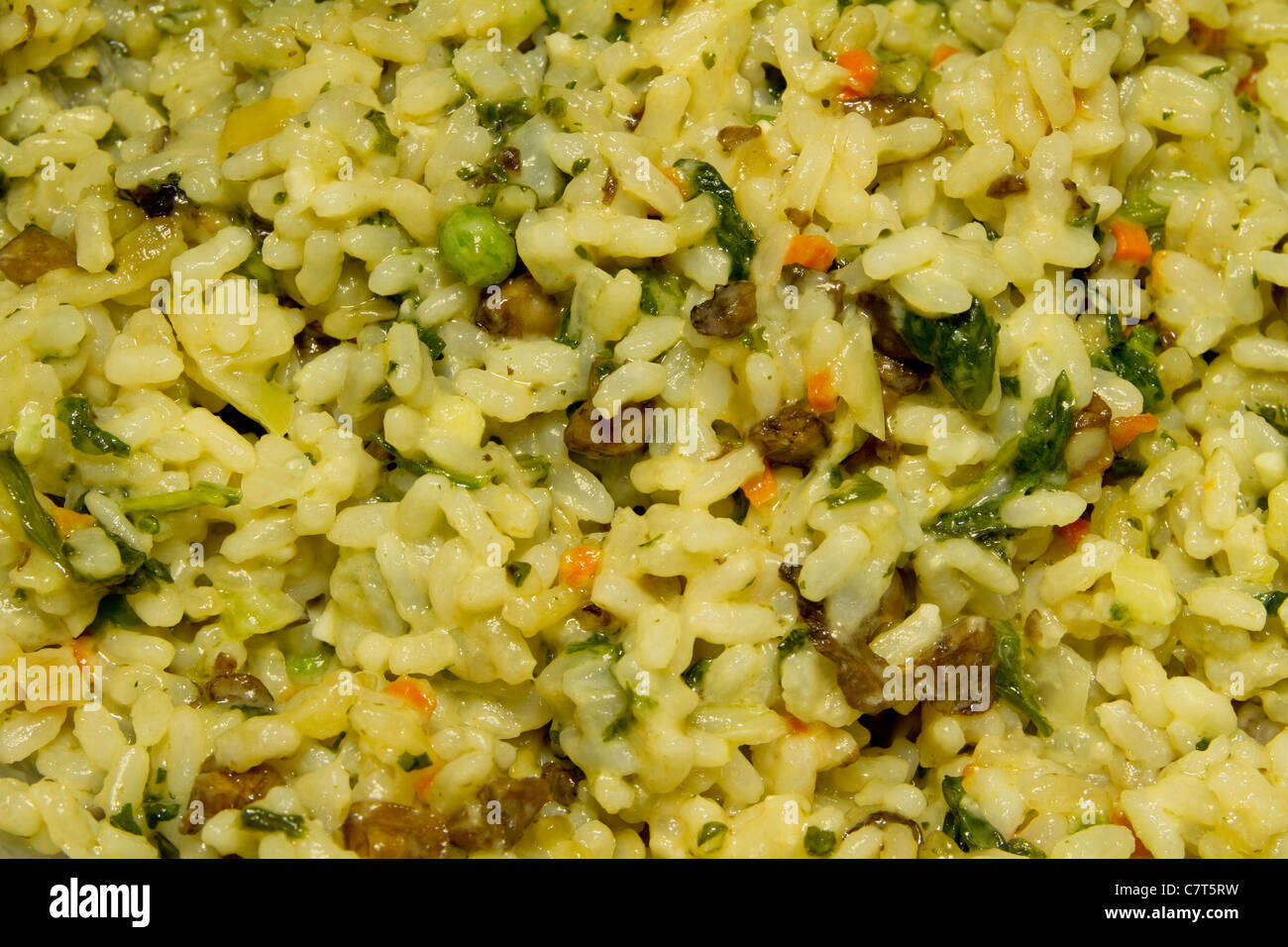 Italian Risotto rice with cream, spinach, assorted vegetables shot very