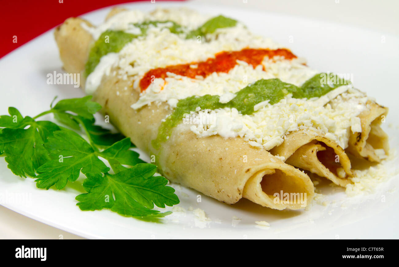 Mexican dish known as tacos dorados Stock Photo Alamy