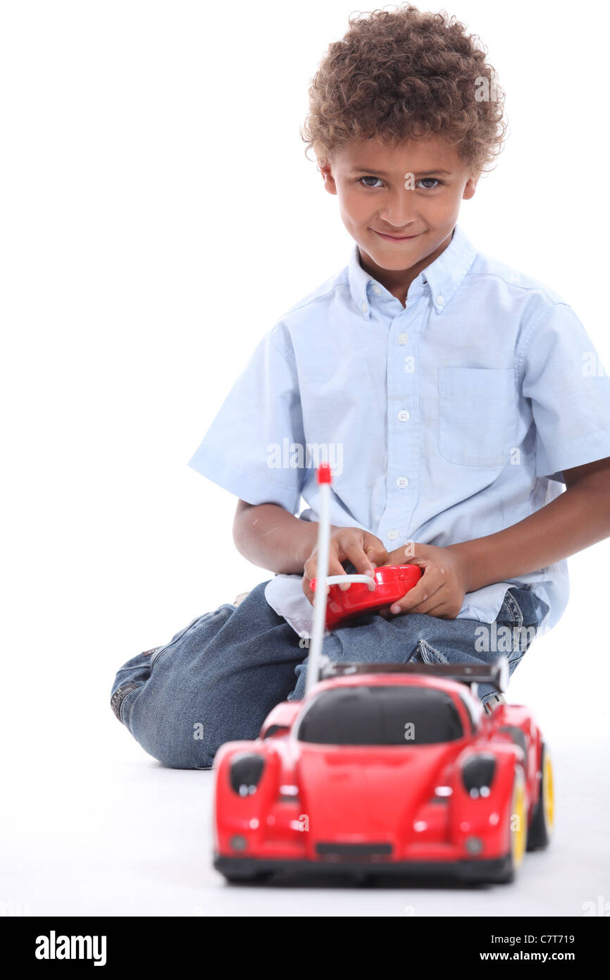 little boy playing with a toy car Stock Photo Alamy