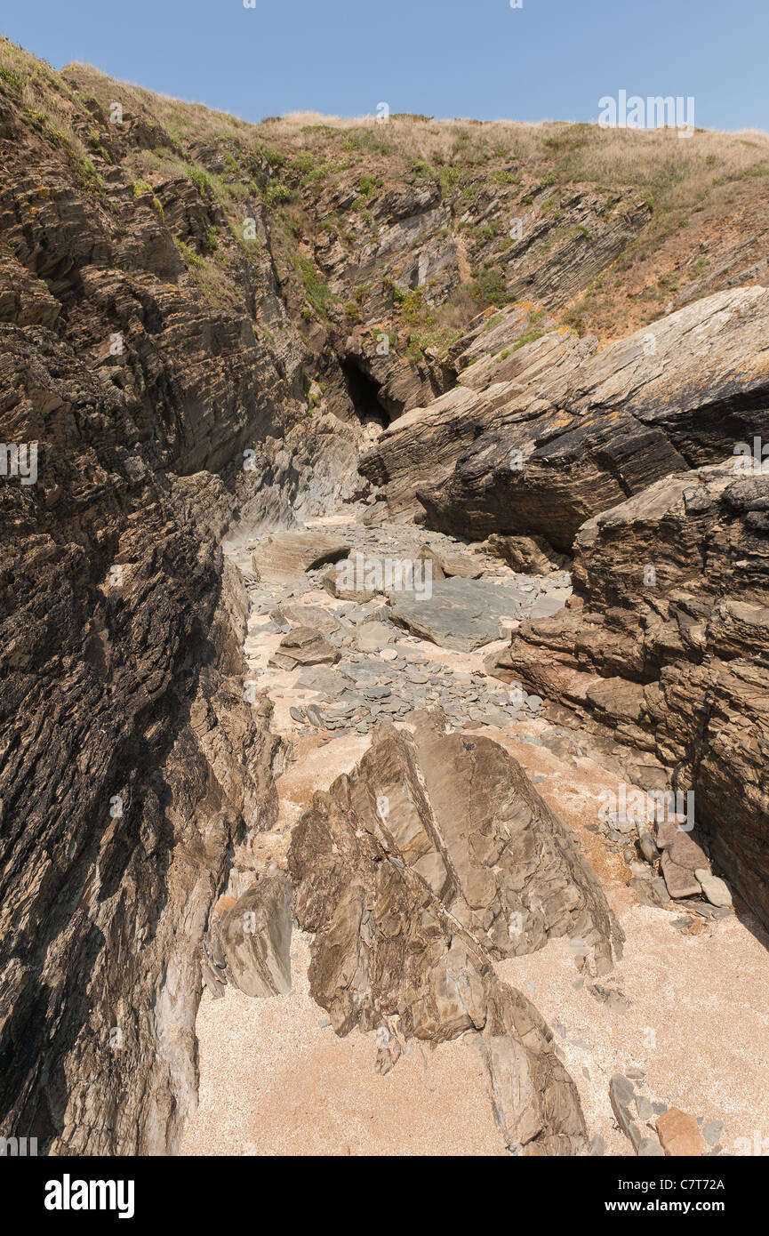 Rockfall , sandstone vein washed out between schist rock vein with a