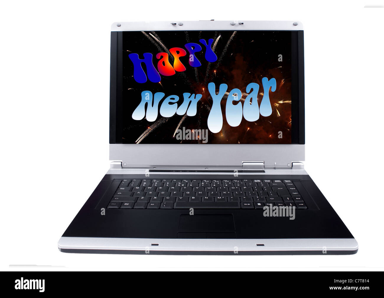 Laptop Computer with an Happy New Year colorful holiday background on the screen.Objects over white. Stock Photo