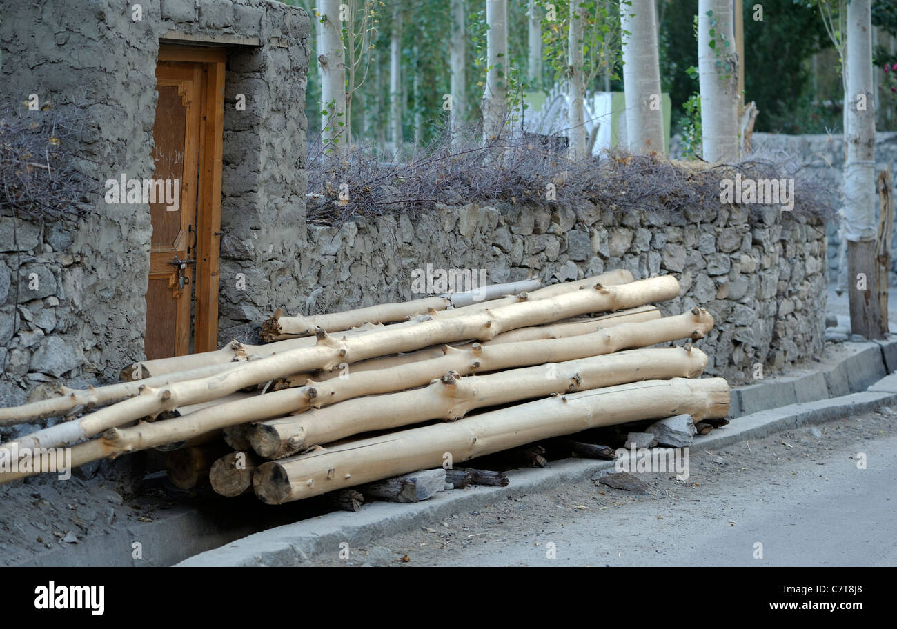 Poplar timber stacked outside a house ready for construction work