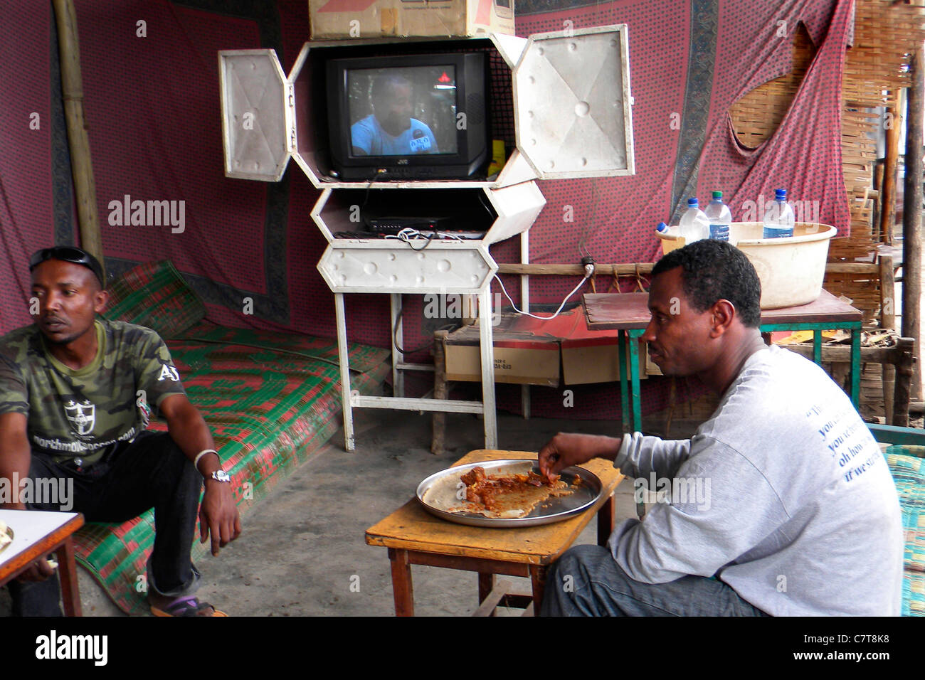 Africa, Ethiopia, Tigray, men eating on street restaurant Stock Photo