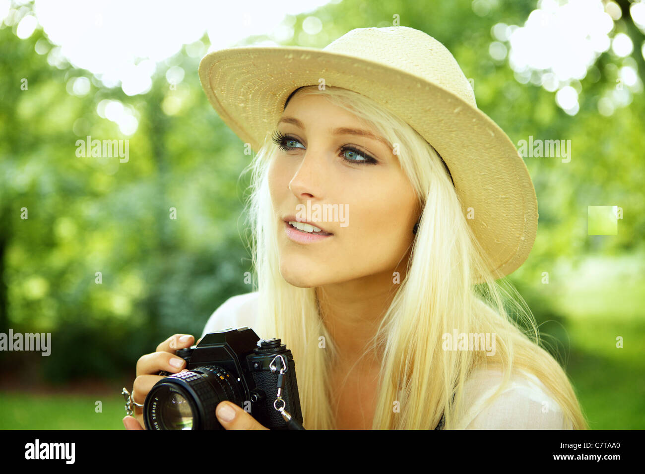 Girl with an old analog camera scouting for subjects Stock Photo Alamy