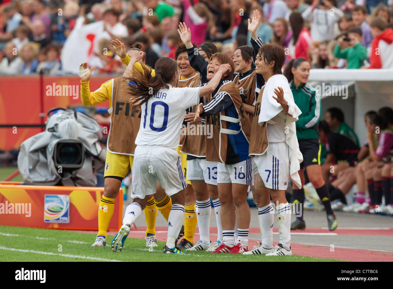Homare Sawa of Japan (10) celebrates with teammates after scoring a goal against Mexico in a 2011 Women's World Cup soccer match Stock Photo