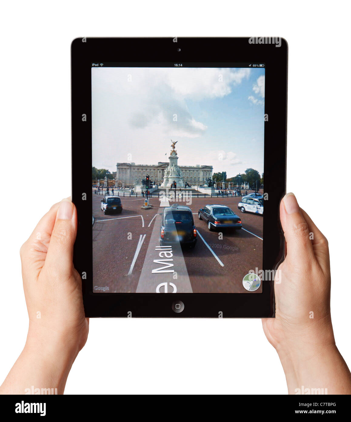 Hands holding an iPad showing Google Street view Stock Photo