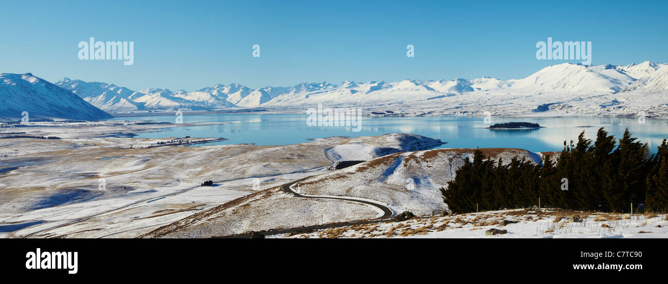 A panoramic shot of Lake Tekapo from Mount John Observatory during a heavy snowfall in New Zealand's winter. Stock Photo