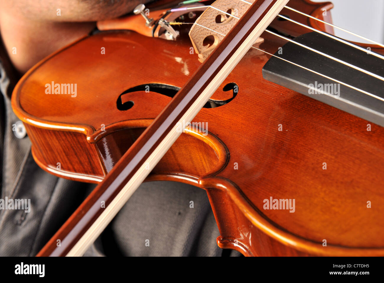 Violin is in the hands of professional violinist. Stock Photo