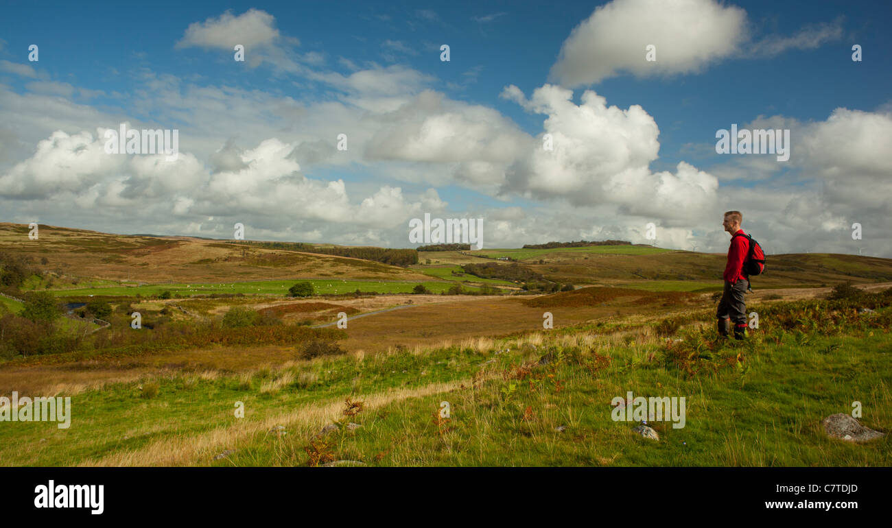 Autumn walker looking down on the Loups of Barnshangan on the Southern Upland Way near New Luce, Galloway, Scotland, UK Stock Photo