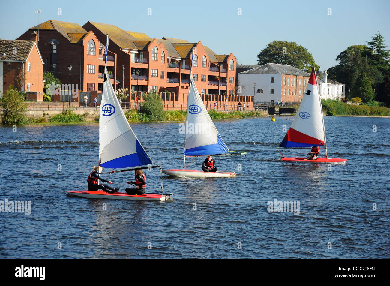 Learning to sail class on the River Exe in Exeter near the Quay and Haven Banks. Stock Photo