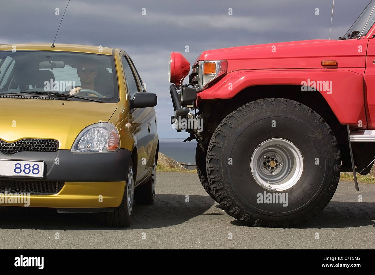 Large truck with small car Stock Photo