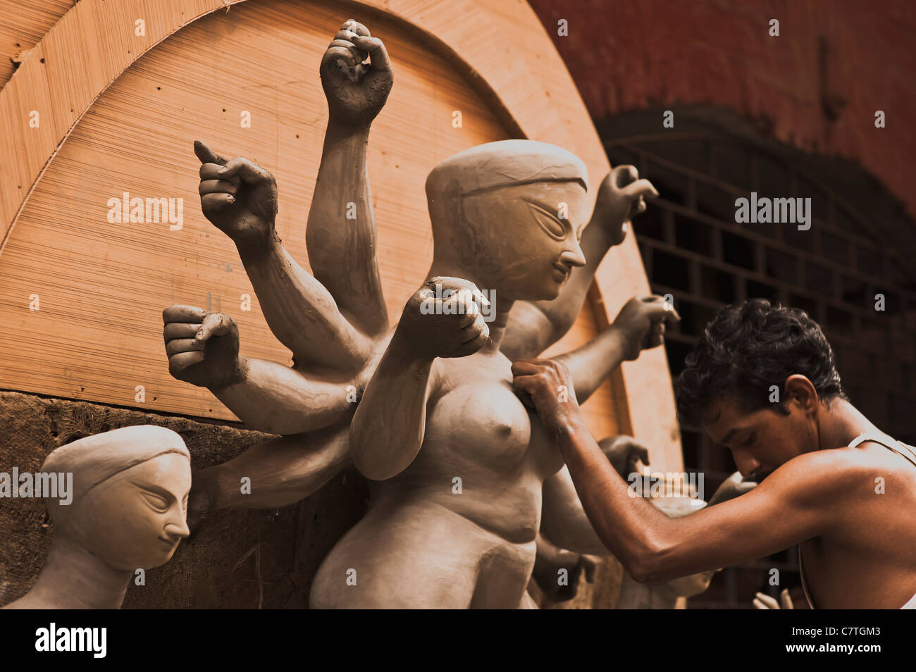 Durga,Her arms,fists,Clay,modeler's,arm,muscle,complimenting,each,other. Stock Photo