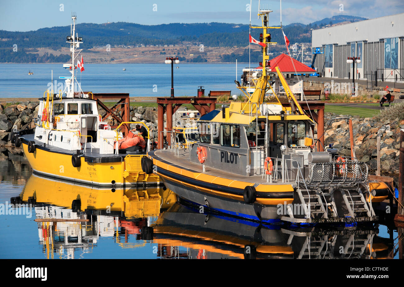 Pilot boats moored at ogden point Victoria BC Canada on a sunny day at the end of the summer Stock Photo