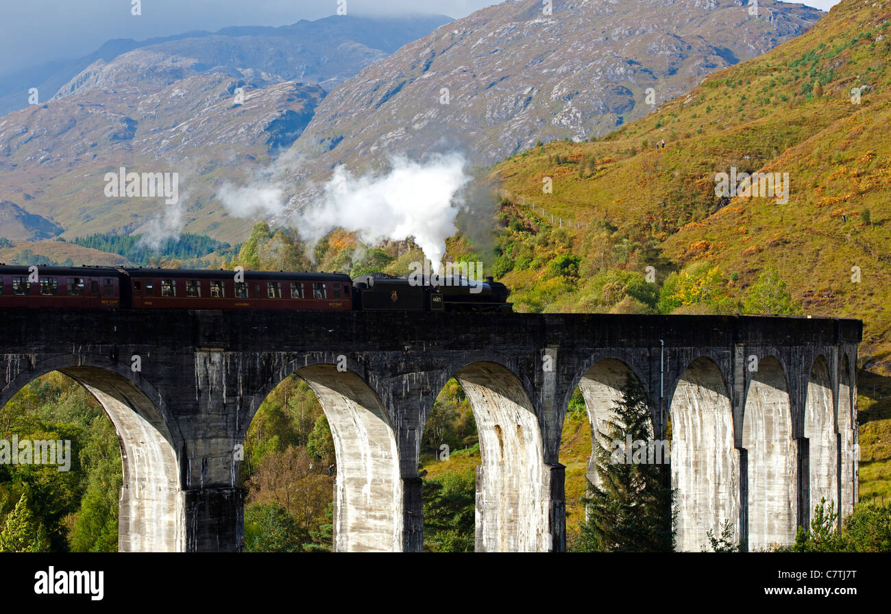 Jacobite Steam Train crossing Glenfinnan Viaduct in autumn  Lochaber, Scotland, UK, Europe Stock Photo