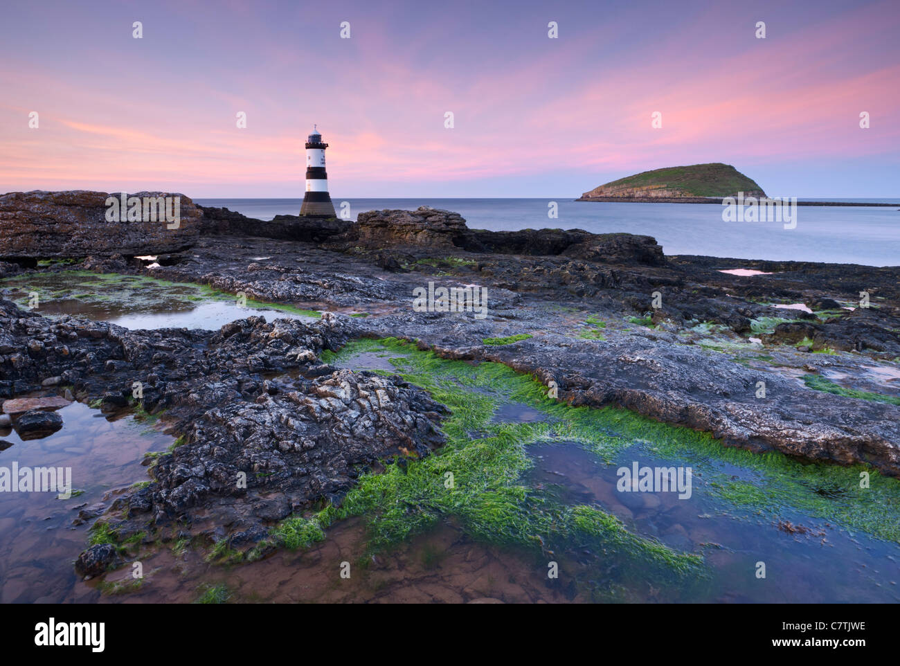 Dusk over Penmon Point Lighthouse and Puffin Island, Isle of Anglesey, Wales, UK. Spring (April) 2011. Stock Photo