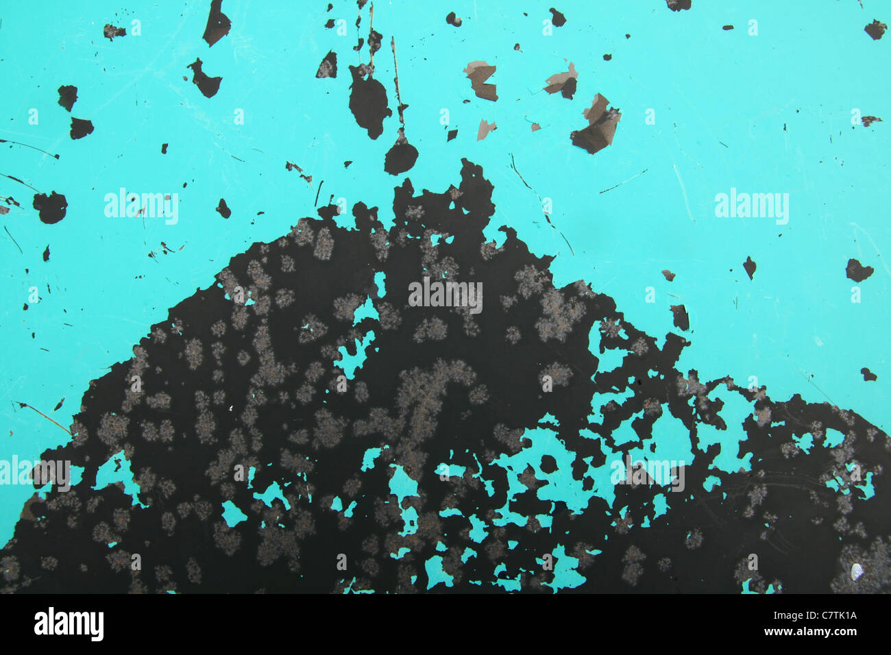 flaking and corroding turquoise painted metal background Stock Photo