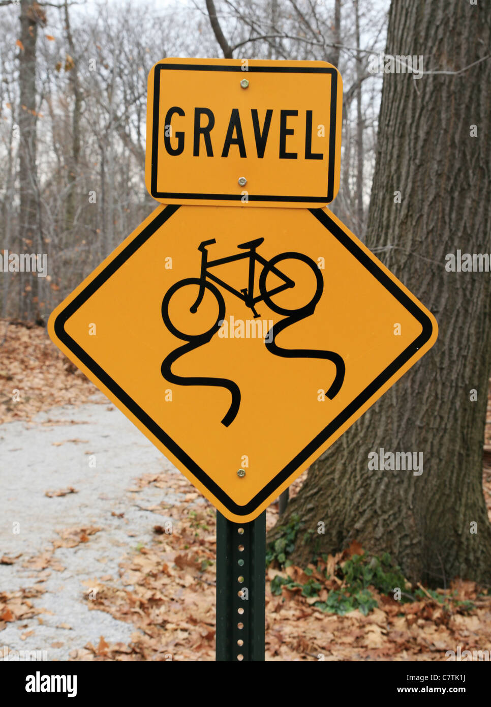 gravel warning sign for bicycle path showing skidding bicycle Stock Photo