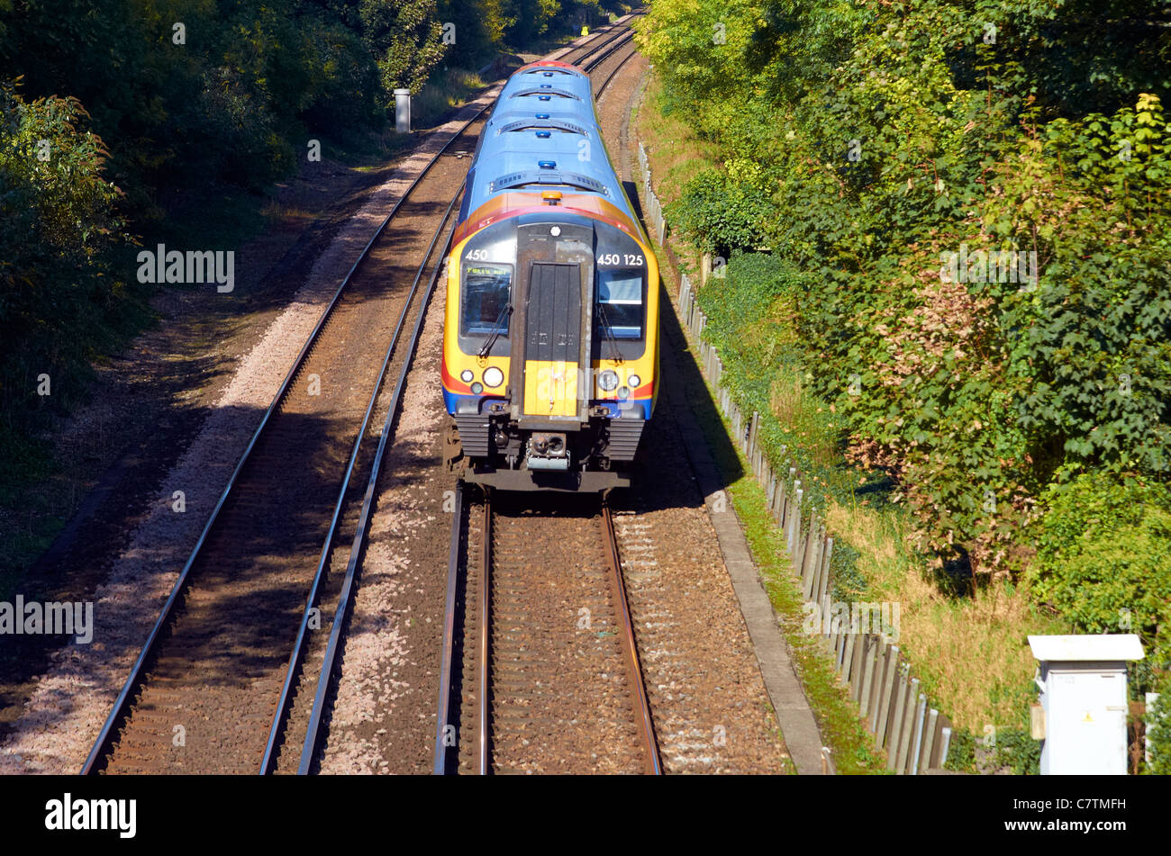 SWT Class 450 electric train on the South Western mainline (London-Bournemouth) just south of Winchester, Hampshire, England. Stock Photo