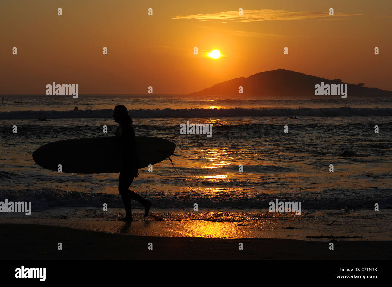 Female surfer beach sunset hi-res stock photography and images - Alamy