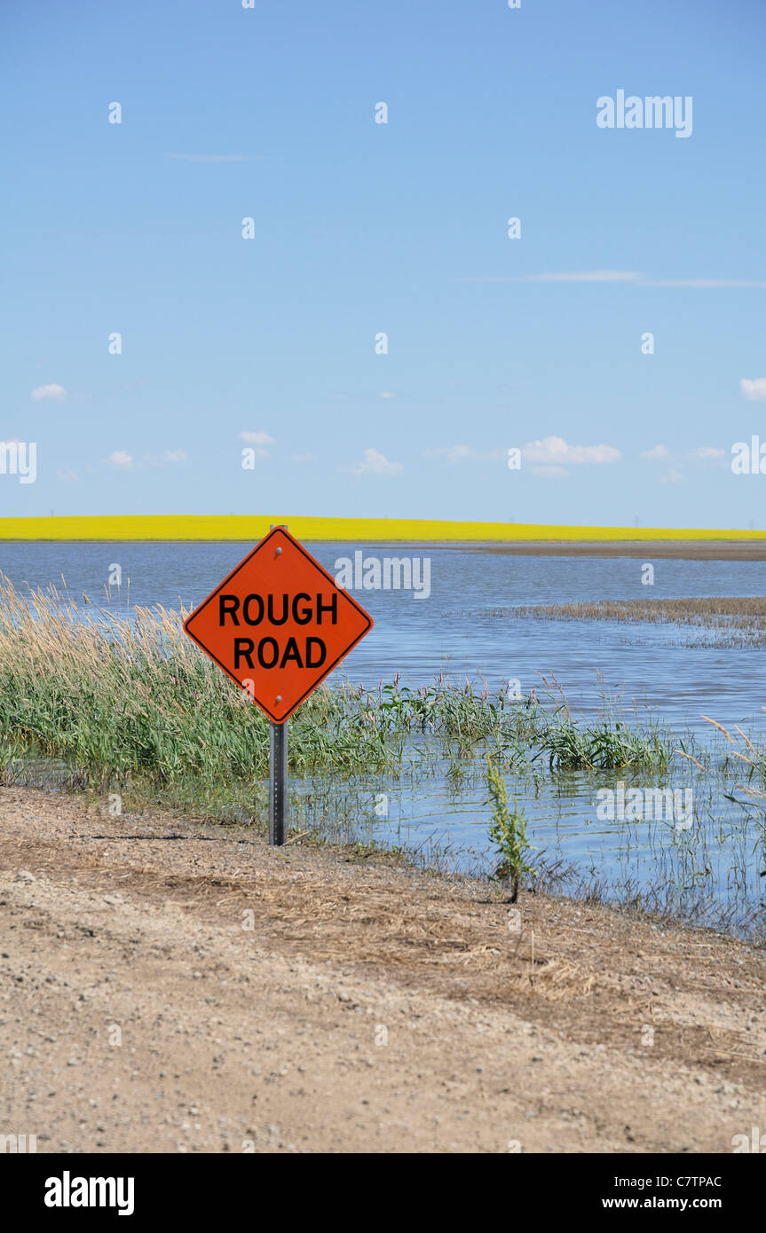 Rough road signs along bumpy roads in rural Saskatchewan, Canada. Stock Photo
